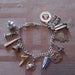 Vintage Sterling Silver Charm Bracelet With Bell Trading Post Statue of Liberty Cannon Crab Maryland Vintage Charms