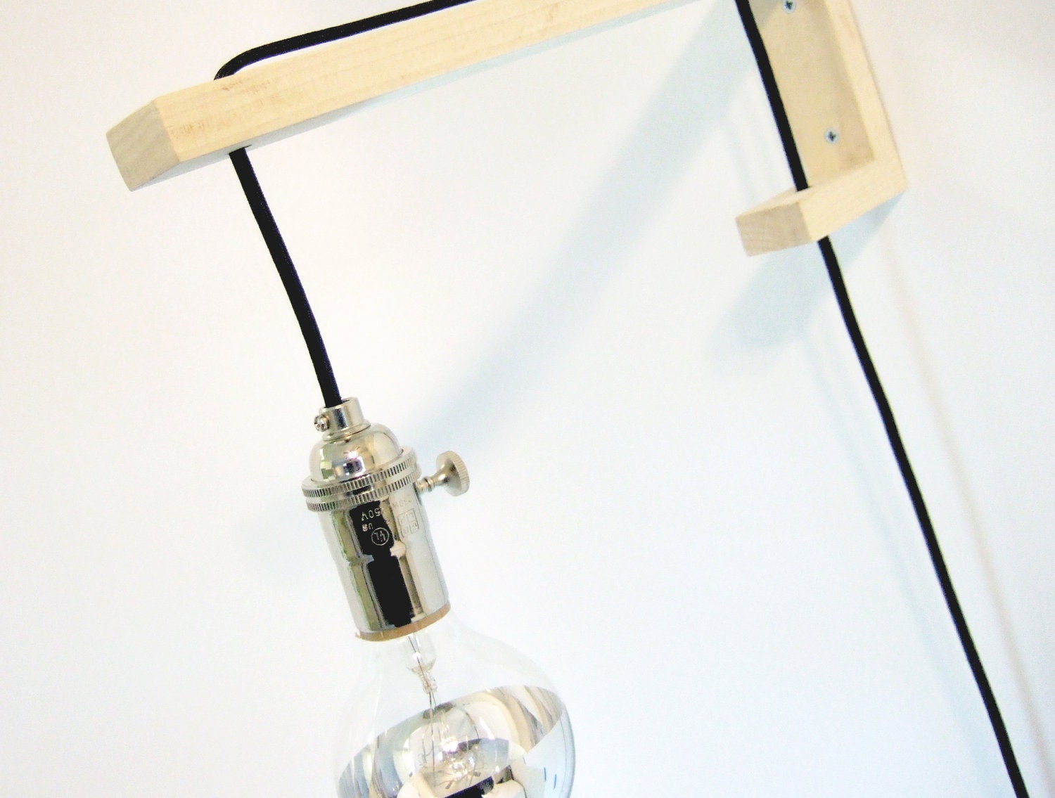 sconce. big J.  with chrome tipped lightbulb.