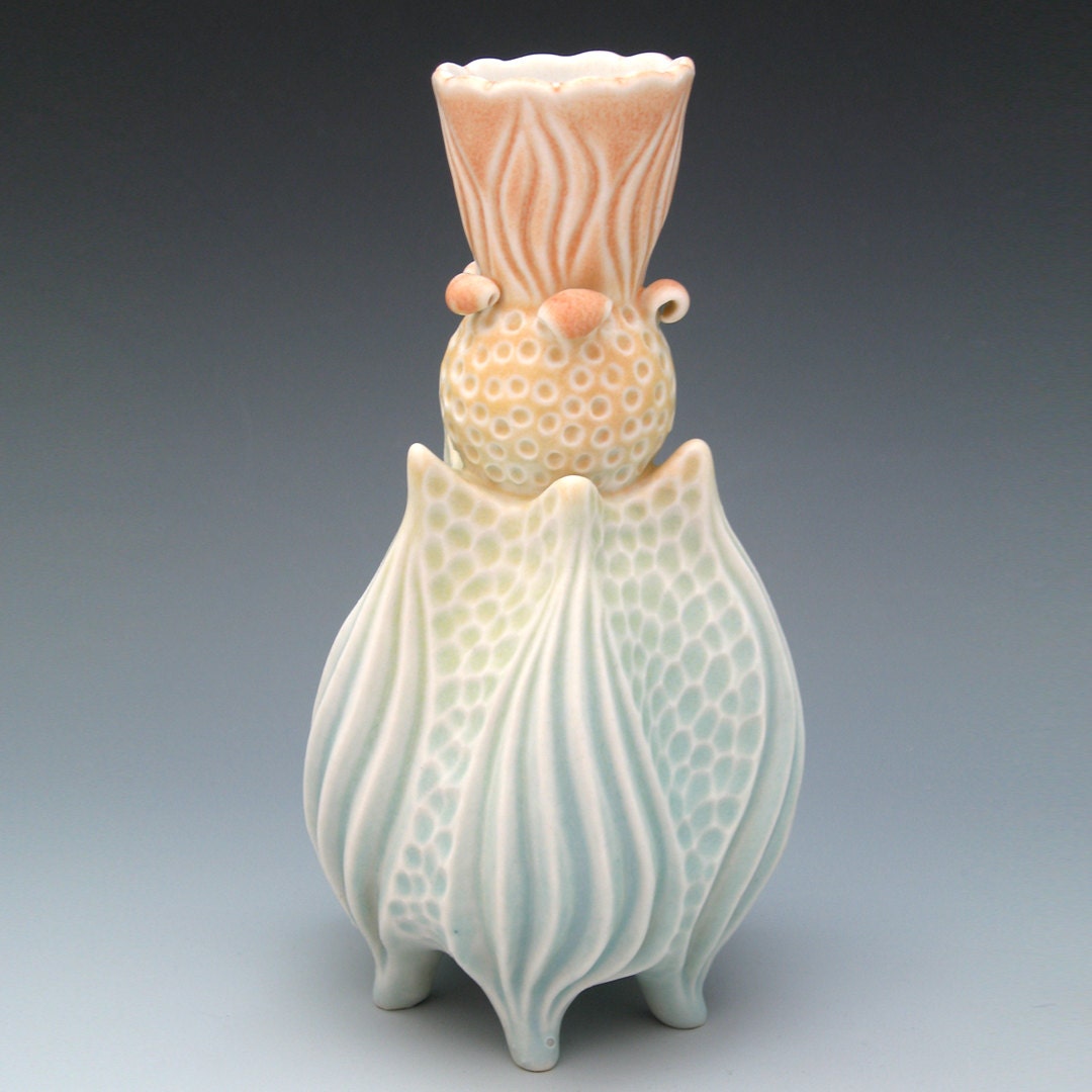 Porcelain vase, carved with scalloped top in pastel yellow, aqua, blue and pink