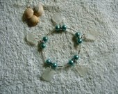 Sea glass charm bracelet with teal pearls. Sea glass jewelry.