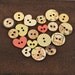 NEW 18 Wood Buttons - Tea-Thyme 559304  - Vintage  distressed wooden buttons with stamped images