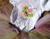 1st birthday butterfly onesie with name, colorful tutu, and matching hair bow