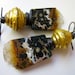 This is Ekstasis - gold leaf lampwork glass bead, primitive black crystal ocean jasper stone drusy slice, and black brass earring pair