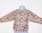 Shirt Saver Full Coverage Baby Bib With Long Sleeves and Pocket - Cupcakes