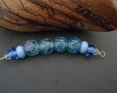 Pretty fritty blues. Handmade Lampwork bead set SRA CPteam FHFTeam