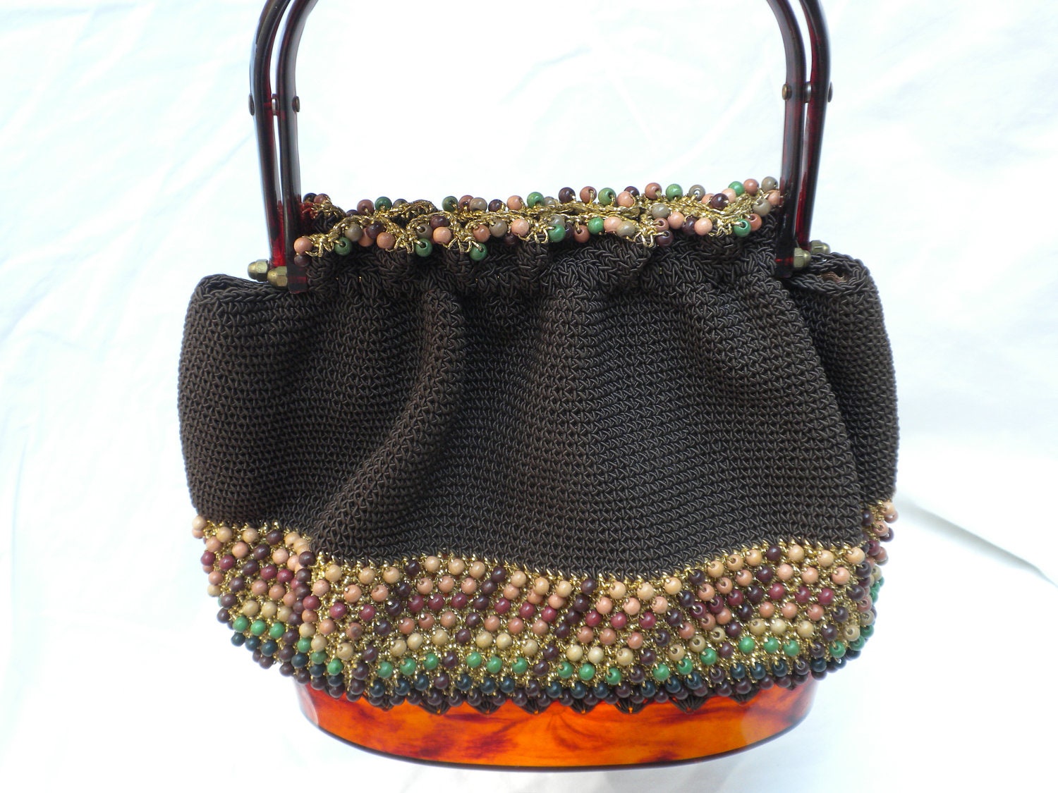 vintage knit and beaded purse, with amber colored base and handles