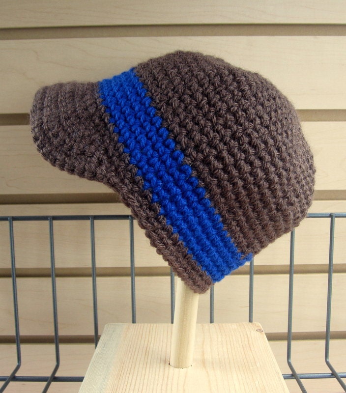 Dark brown newsboy style crochet hat with royal blue accent stripe