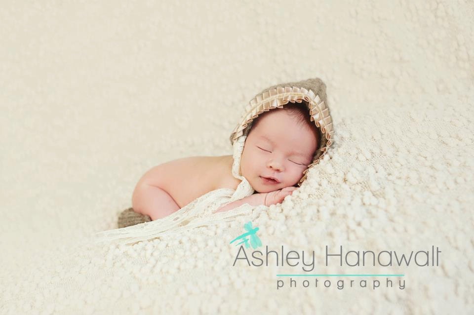 Satin trimmed newborn bonnet