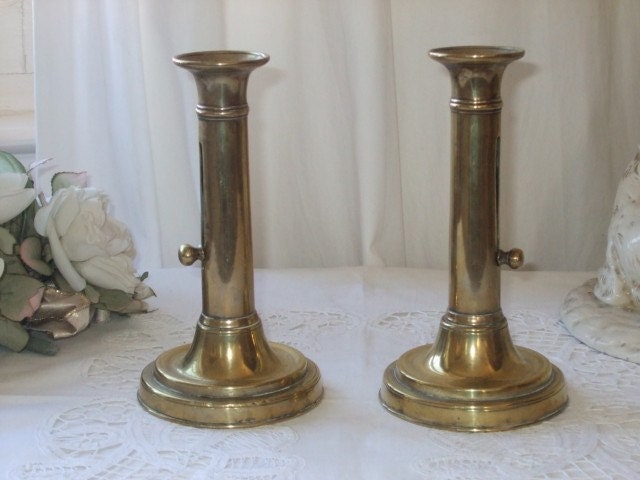 Antique vintage French pair of brass candle sticks, holders, with candle push ups.  Paris apartment, cottage chic.