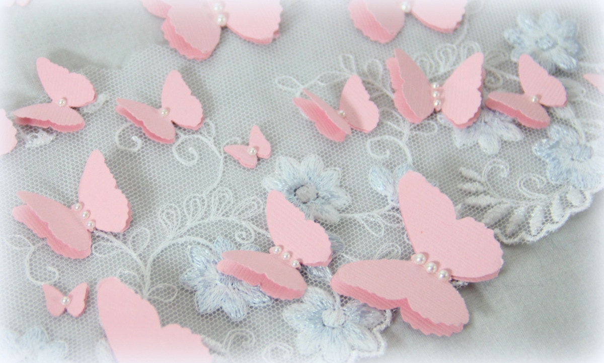 Set of 20 butterfly embellishments with pearls.