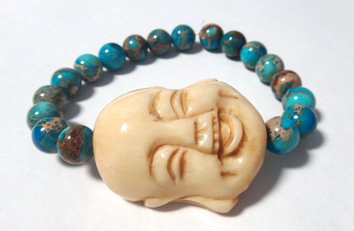 Turquoise Magnesite Beaded Bracelet with Off-White Carved Buddha