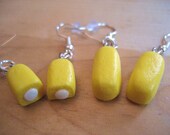 Snack cake Twinkie earrings made from polymer clay.