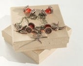 Ruby and Bronze Chain Bracelet with Bronze Birds and Ruby Red Bead Dangles