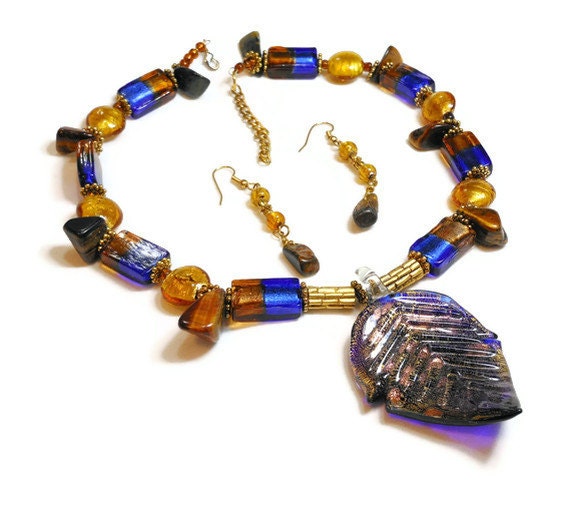 Artisan made Murano Style Cobalt & Copper Foil Leaf Pendant and dangle earrings with Hawaiian Tiger's eye statement piece.