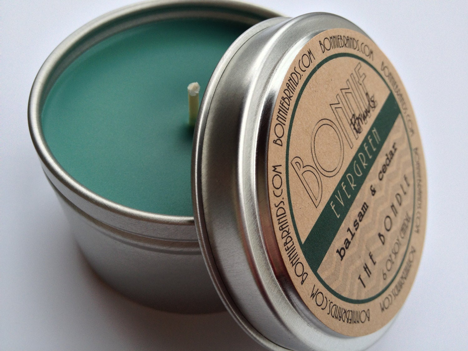 The Bondle: 6 oz Evergreen Christmas Soy Candle flavored with Balsam & Cedar in a Seamless Tin