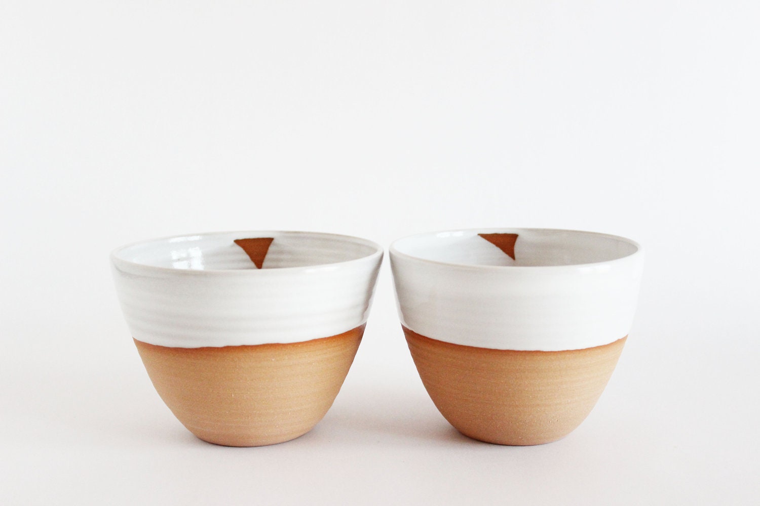 Modern white ceramic tea cups, two pottery tea bowls