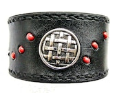 Black leather wristband with button and glass bead inlay.