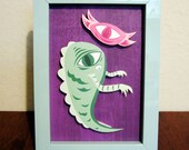 Cyclops Monster Duo 1 - Colorful Cut Paper Framed Wall Art - Purple, Green, Pink with Teal Frame