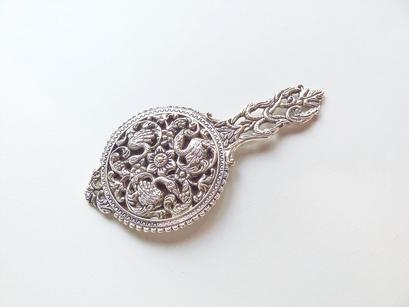 ornate hand mirror