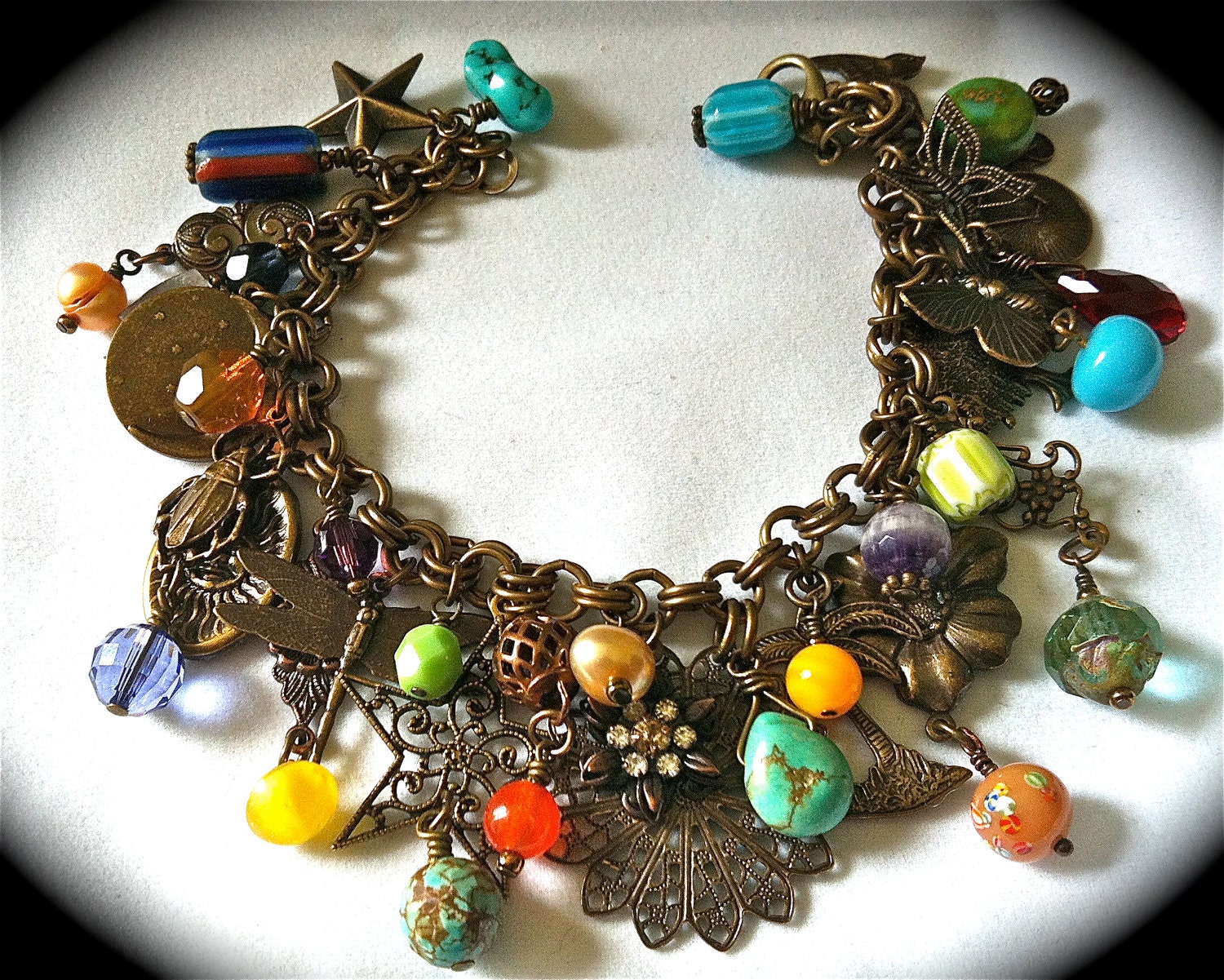 Antiqued brass charm bracelet/necklace with nature theme & vintage beads, crystals, turquoise, trade beads charms, filigree....
