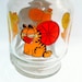 Vintage Garfield glass carafe juice pitcher with lid.