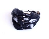 Black patterned bracelet made of recycled jersey