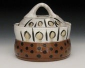 green dot yellow dot lidded jar with polka dots on white and brown