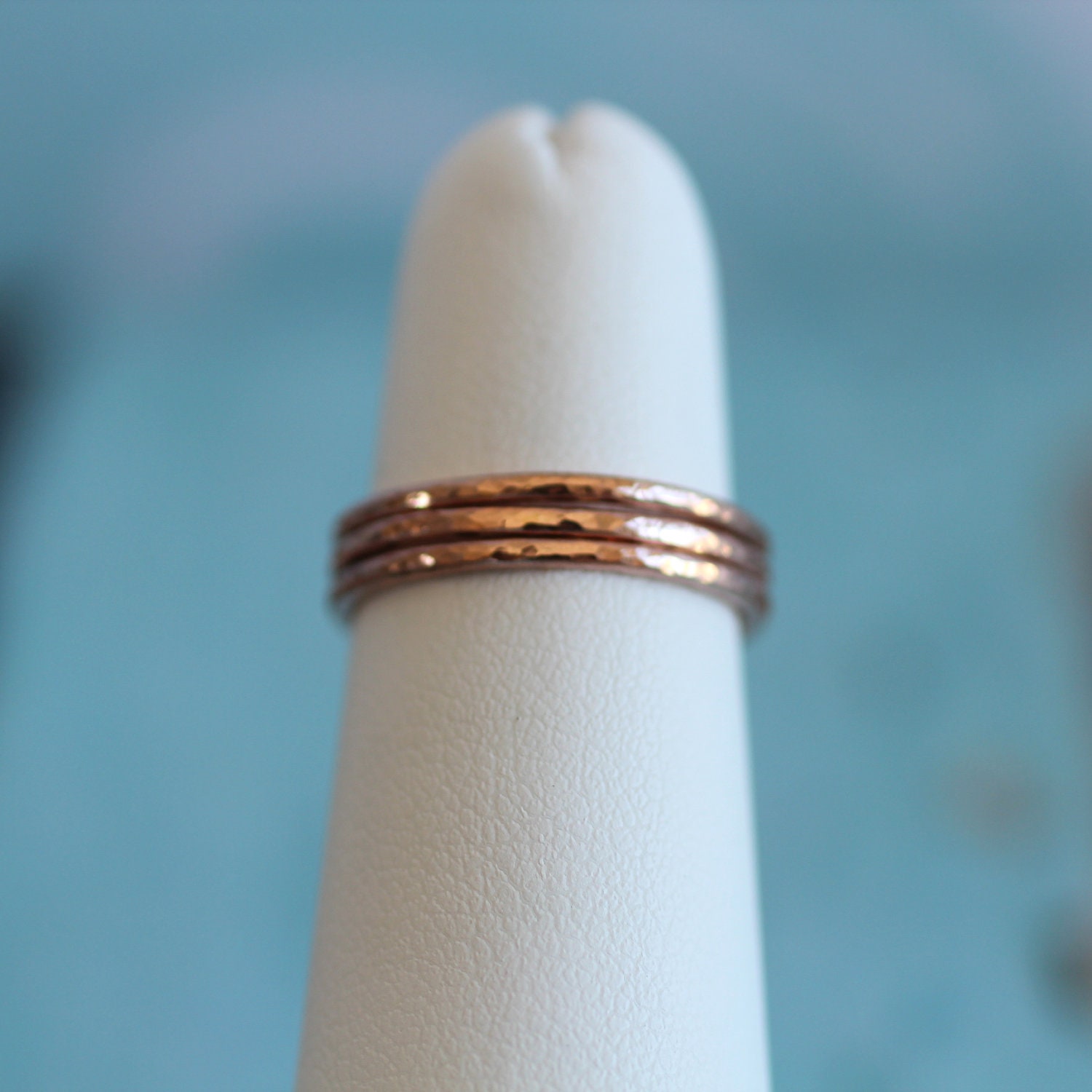 three thin stacking rings.  hammered texture.  rose gold fill.  16 gauge.  made to order.