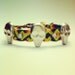 Friendship bracelet with silver skull studs and rhinestones in rasta color