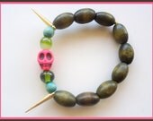 Pink Howlite Skull Stretch Handmade Bracelet with Gold Spikes and Green Wooden Beads - "The Juliet"