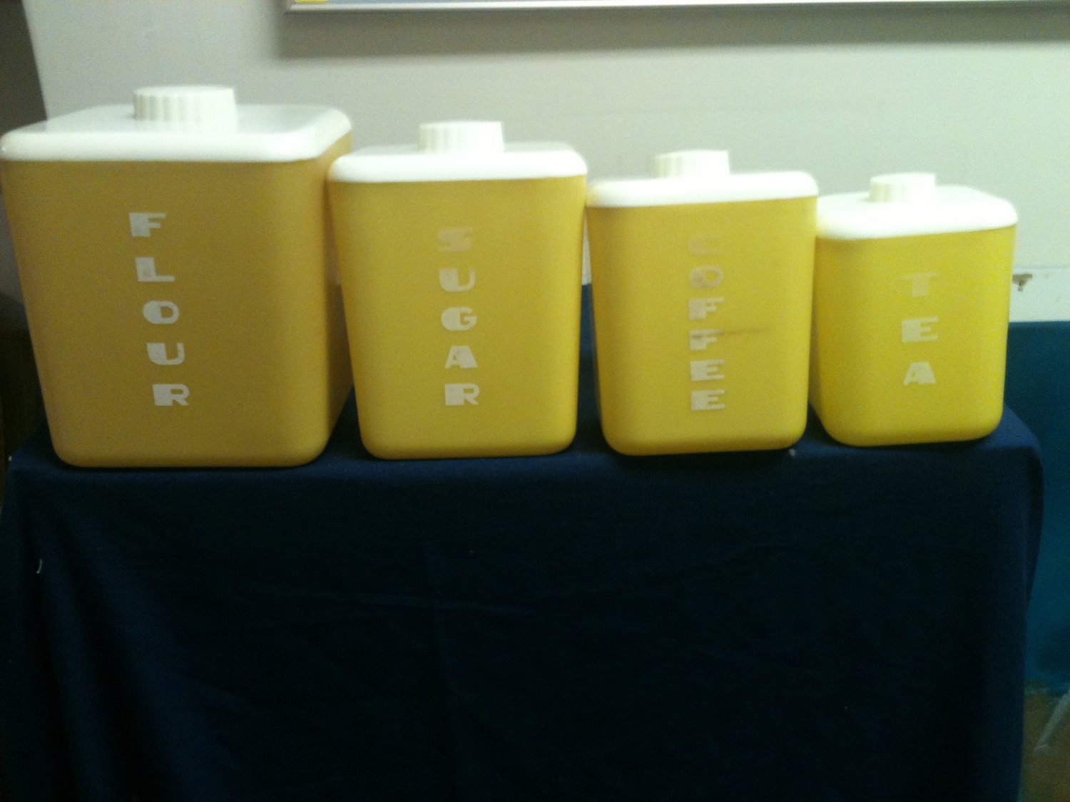 1950's 4 piece Plastic Yellow Lustro Ware Canister Set with White Lids (flour, sugar, coffee, tea)