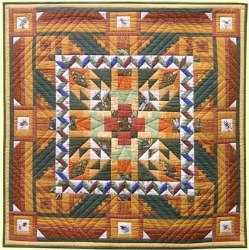 Quilt with insects. The beautiful golden brown color makes this quilt special
