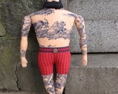 Big tattoo man with Forelock