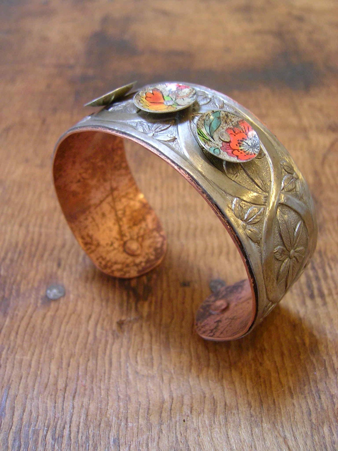 Cuff Bangle. Vintage steel and reclaimed tins, patinaed copper. Orange bursts.