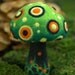 Green felted fantasy mushroom