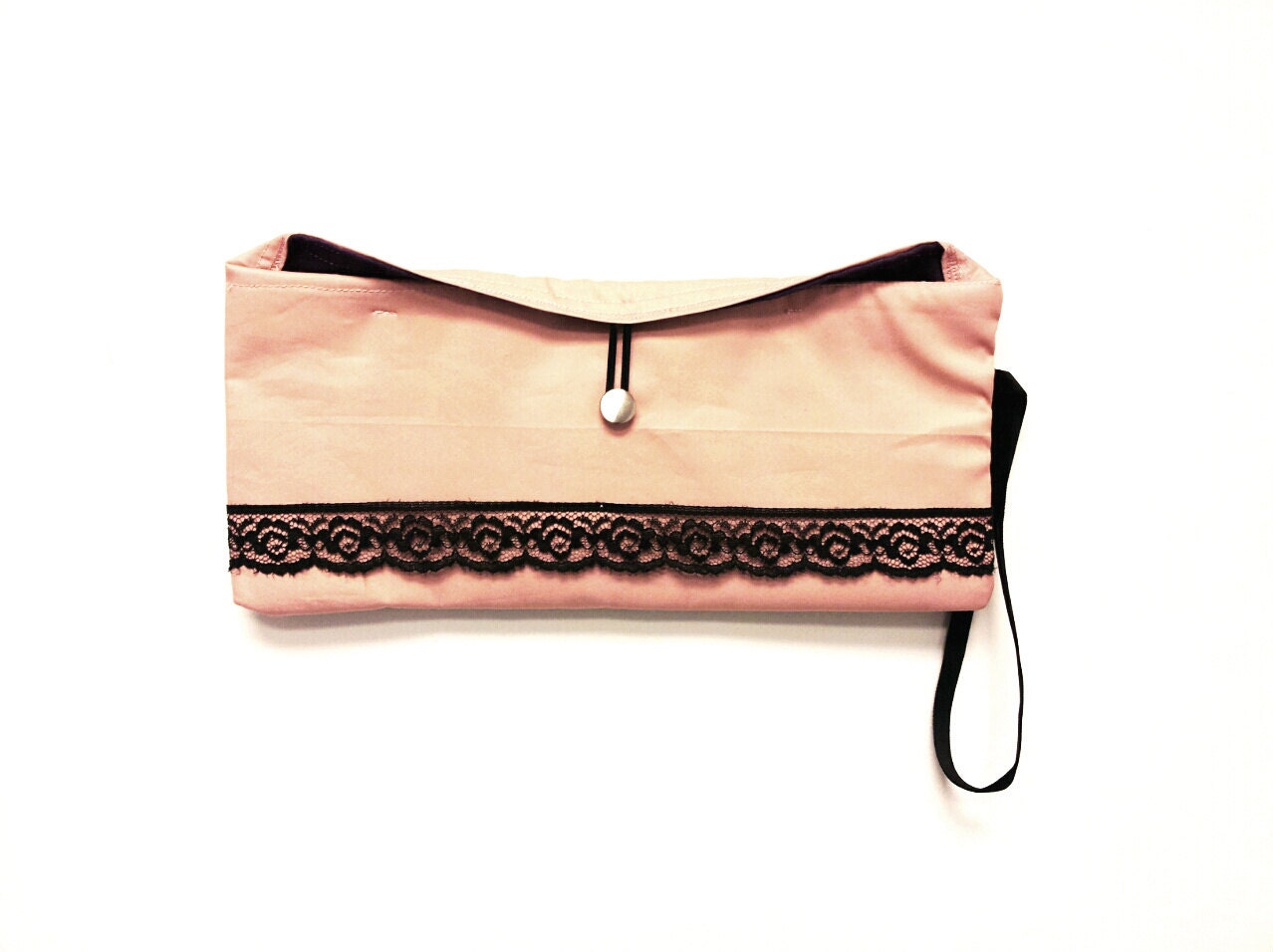 Light pink clutch wrapped in a black lace band and a beautifully soft purple suede interior