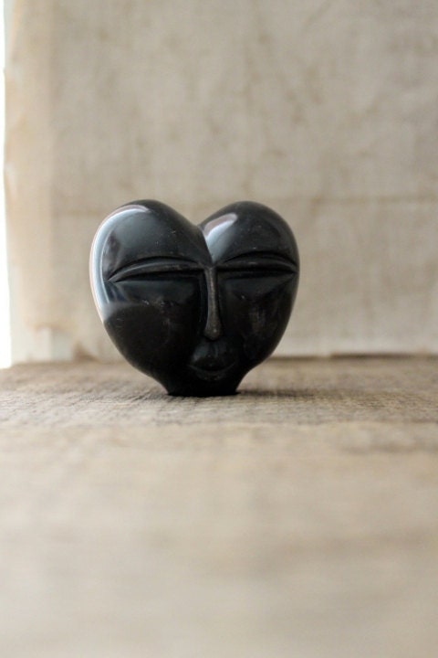 v i n t a g e carved stone heart face