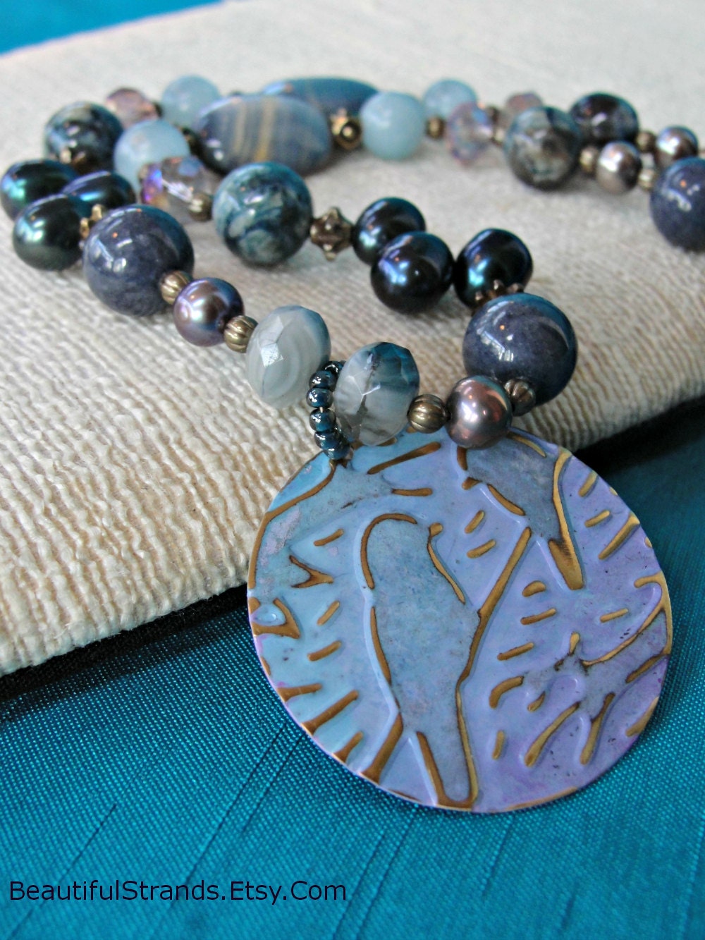 Blue and Orchid Embossed and Painted Pair of Birds Pendant on Gemstone Necklace