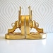 Gun Bookends in gold