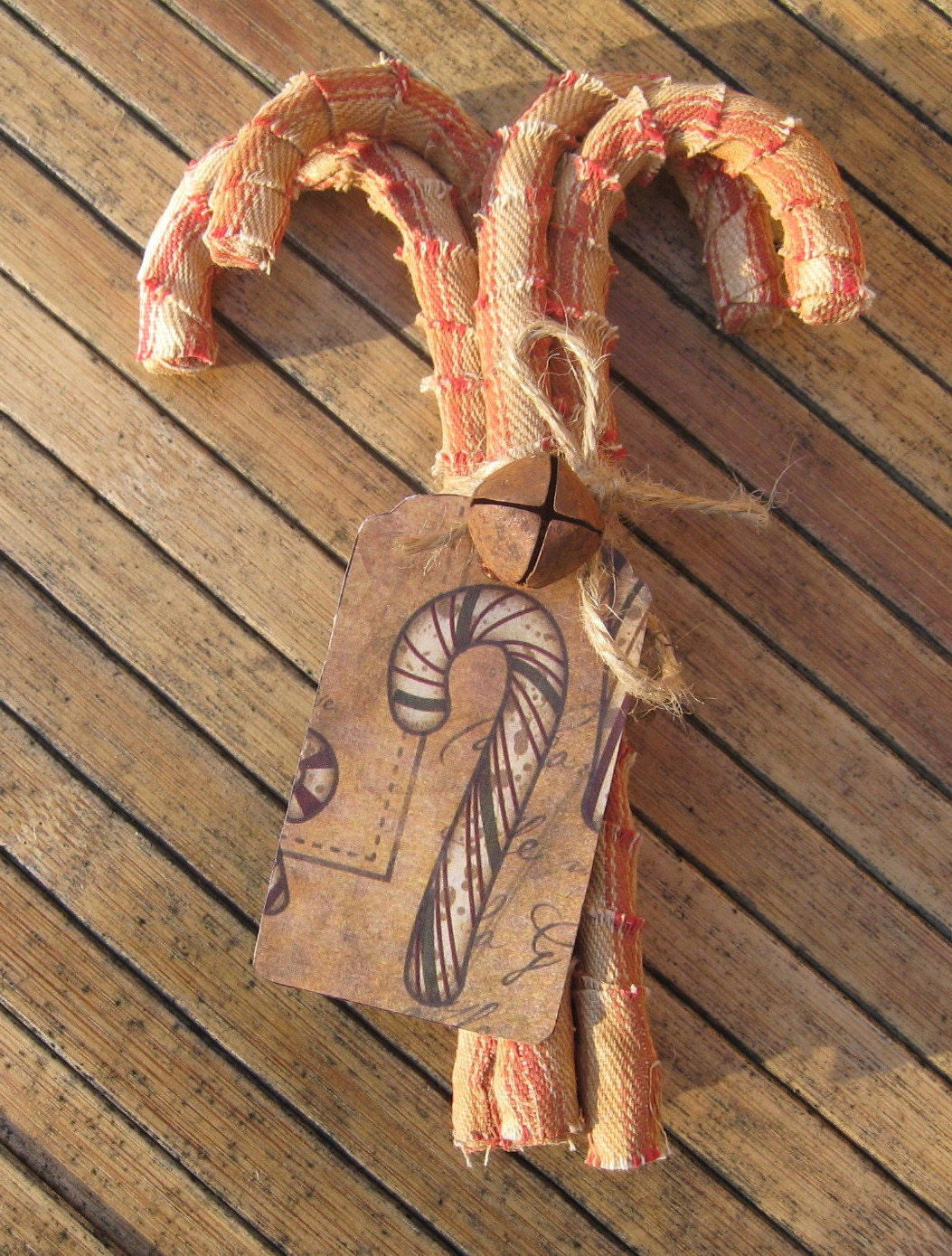 Items similar to Handmade Primitive Fabric Covered Candy Canes with Rusty Jingle Bell on Etsy