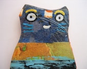 Painted and collaged cat pin with stripes