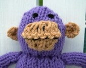 Purple hand knitted monkey