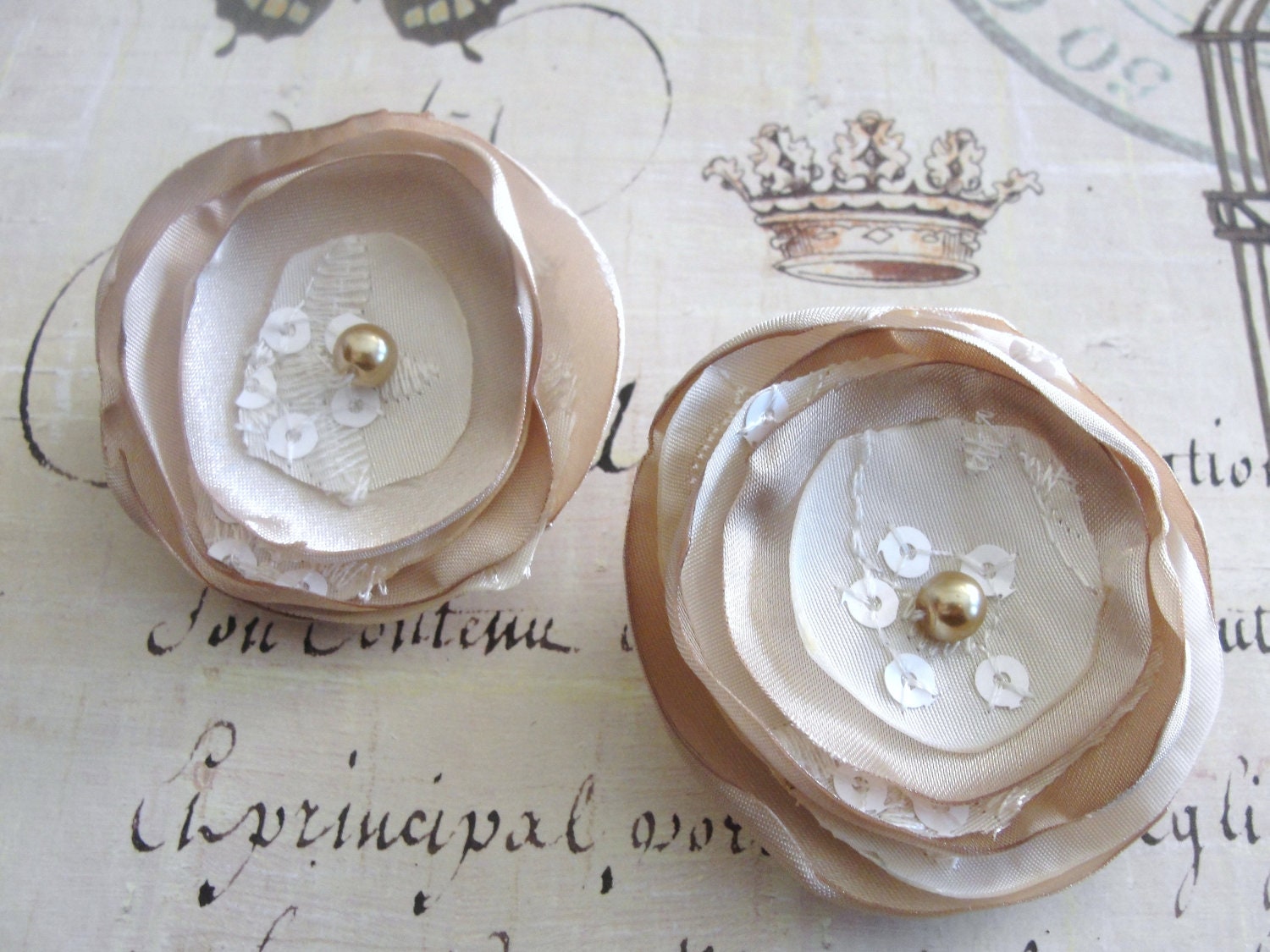 2 champagne embroidered satin hair flowers