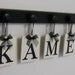 Unique Wedding Gift Idea Family Name Hanging Wood Sign Set Includes Name KAMEN and 5 Wooden Hooks Black