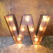 letter lighted W 14 inch tall steel channel letter