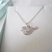 Sterling Silver Singing Bird Charm. Silver Love Bird Necklace. Love Bird Necklace. Silver Bird Pendant with heart wing.