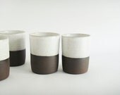Set of four cups, white and dark brown tumbler, modern pottery