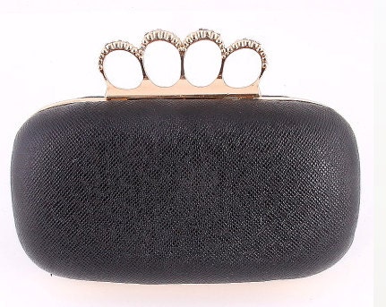 black purse with gold accents