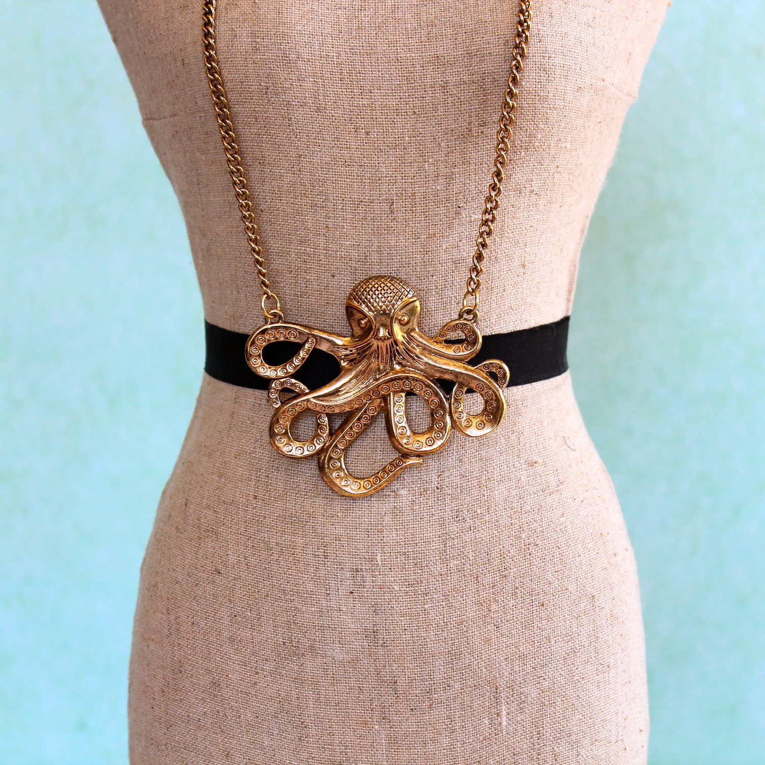 octopus.  large octopus pendent necklace.  antiqued gold tone.  blue sea glass.  pearl.