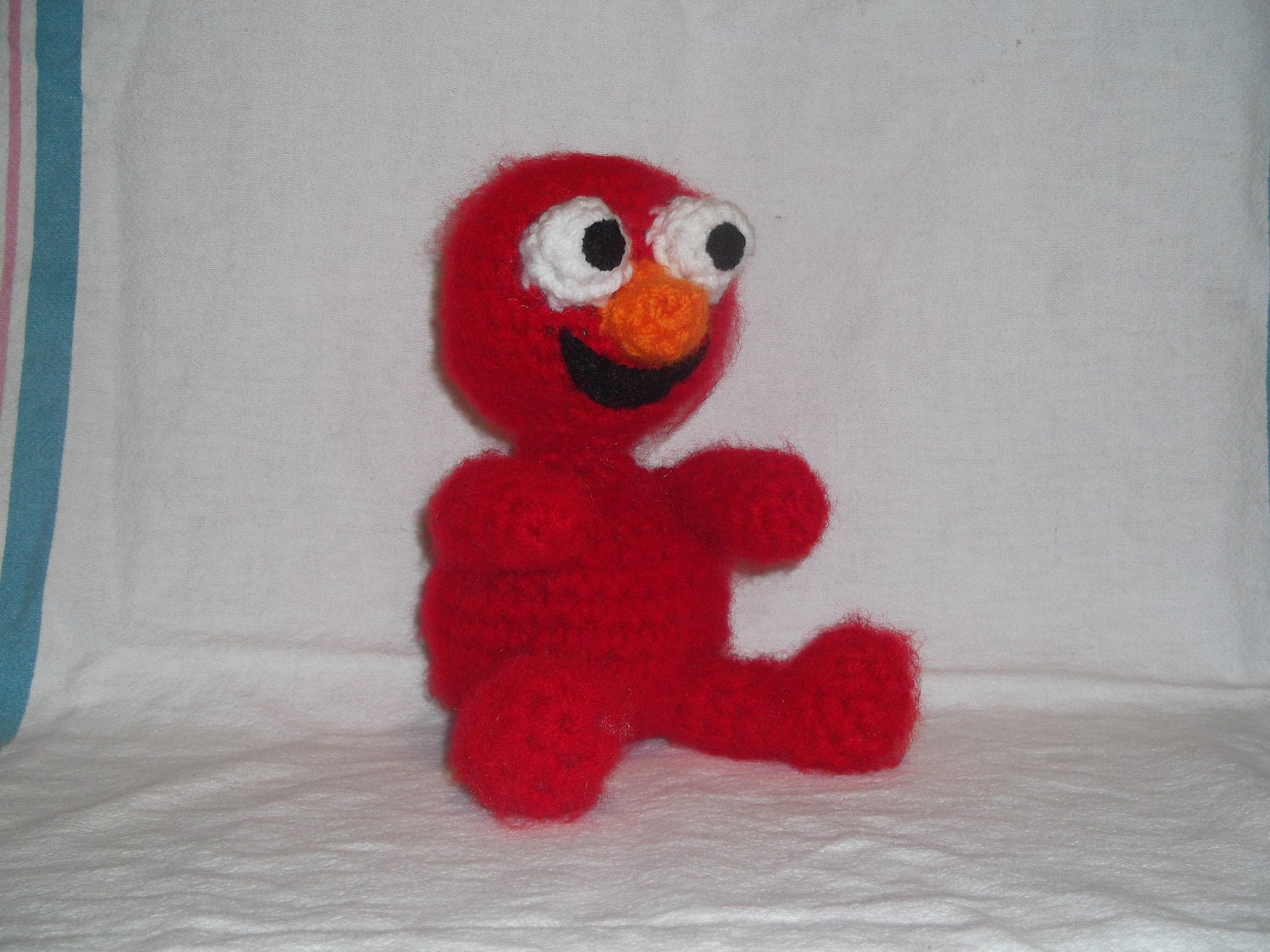 small stuffed elmo doll